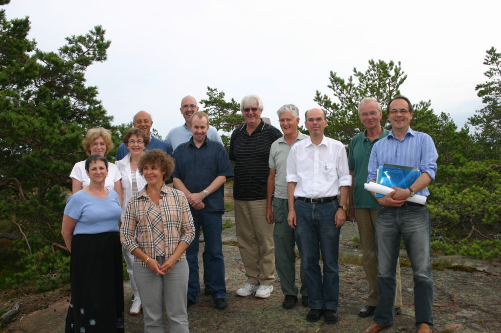 Picture from the album of Hiram Fitzgerald. WAIMH Board members in Ahvenanmaa archipelago, Finland, in July 2007. First row from left: Rachel Schiffman, Tuula Tamminen. Second row from left: Elizabeth Tuters, Pälvi Kaukonen, Mark Tomlinson. Third row from left: Massimo Ammaniti, Neil Boris, Hiram Fitzgerald, Bob Emde, Kai von Klitzing, Peter de Chateau and Antoine Guedeney.